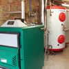 Non Domestic RHI 60kW Angus Super log boiler with two Akvarterm 1500litre buffer tanks in Somerset