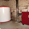 Eco Angus 60kW Orligno log boiler with 5000litre tank for district heating installed in Somerset